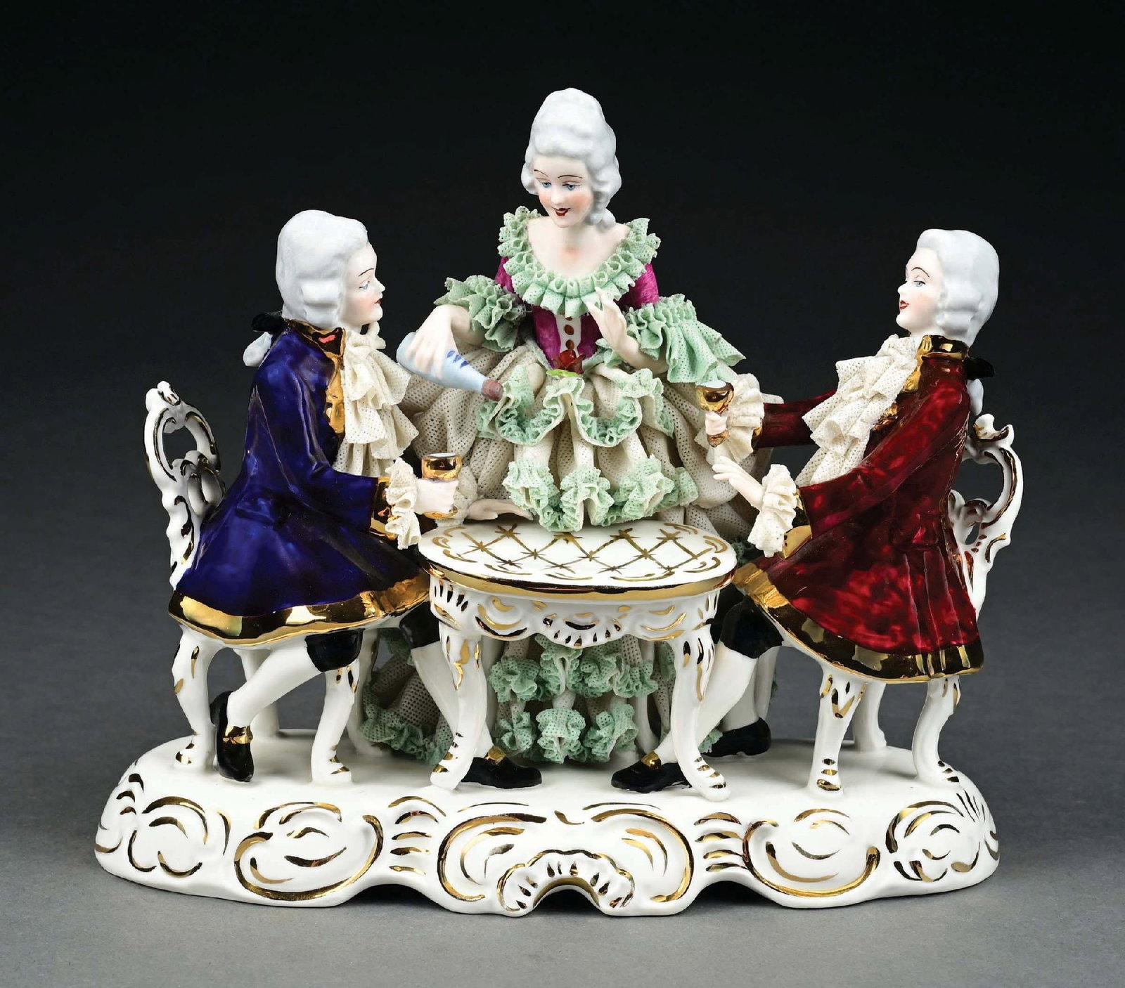 DRESDAN LACE 2 GENTLEMAN & LADY TAVERN SCENE: Nice figural scene of lady pouring gentleman drinks. Some damage to lace. Condition: (Excellent) Dimensions: 9" x 5 - 1/4" x 8".