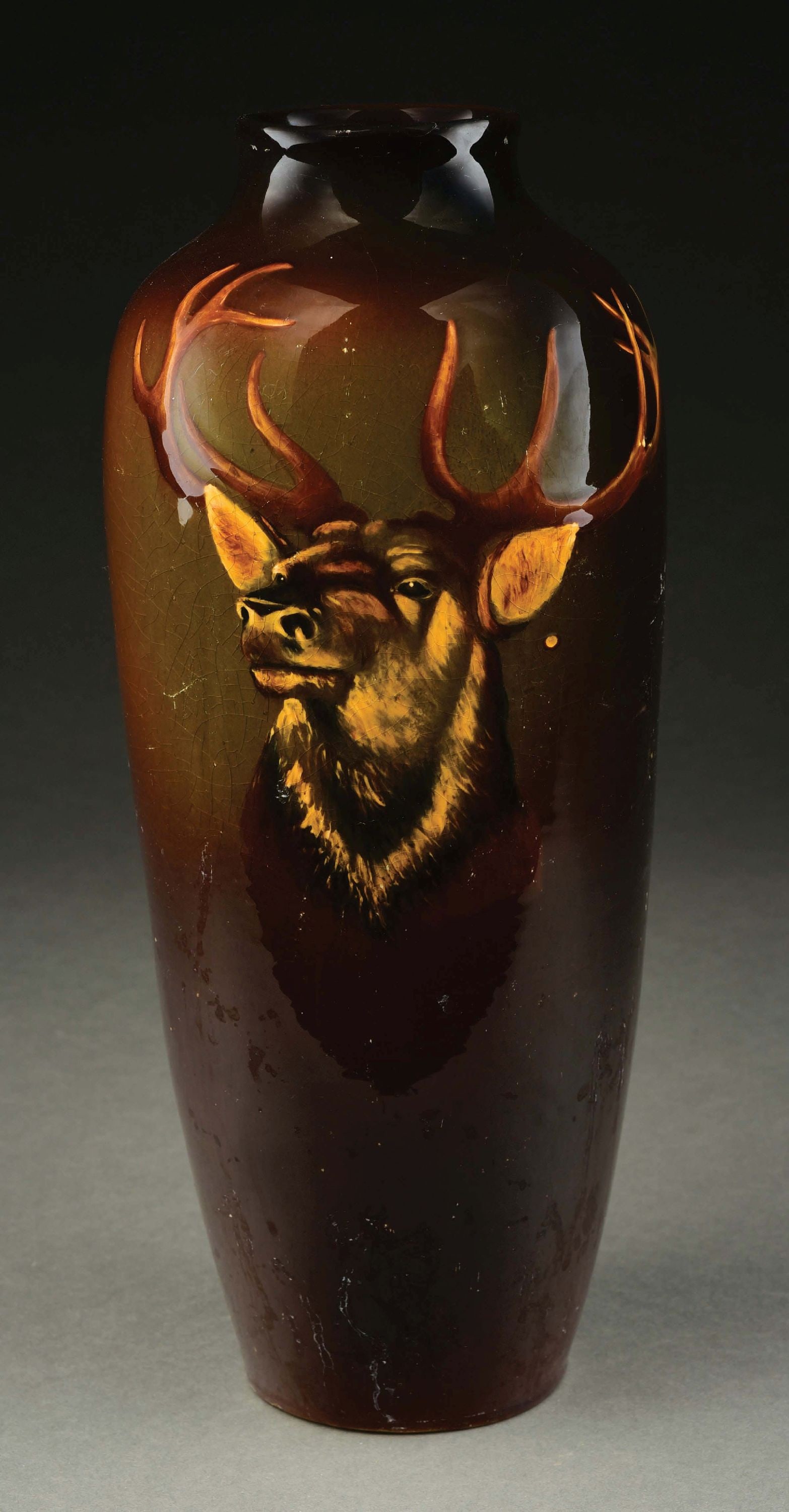 ANTIQUE CAMBRIDGE POTTERY W/ PAINTED STAG: Realistic stag. Small spot by left ear appears to be factory-made, as it has glaze. Minor age crazing. Has scuffing that should clean. Signed "Cambridge" on bottom, #226. No repairs. Condition: Dimens