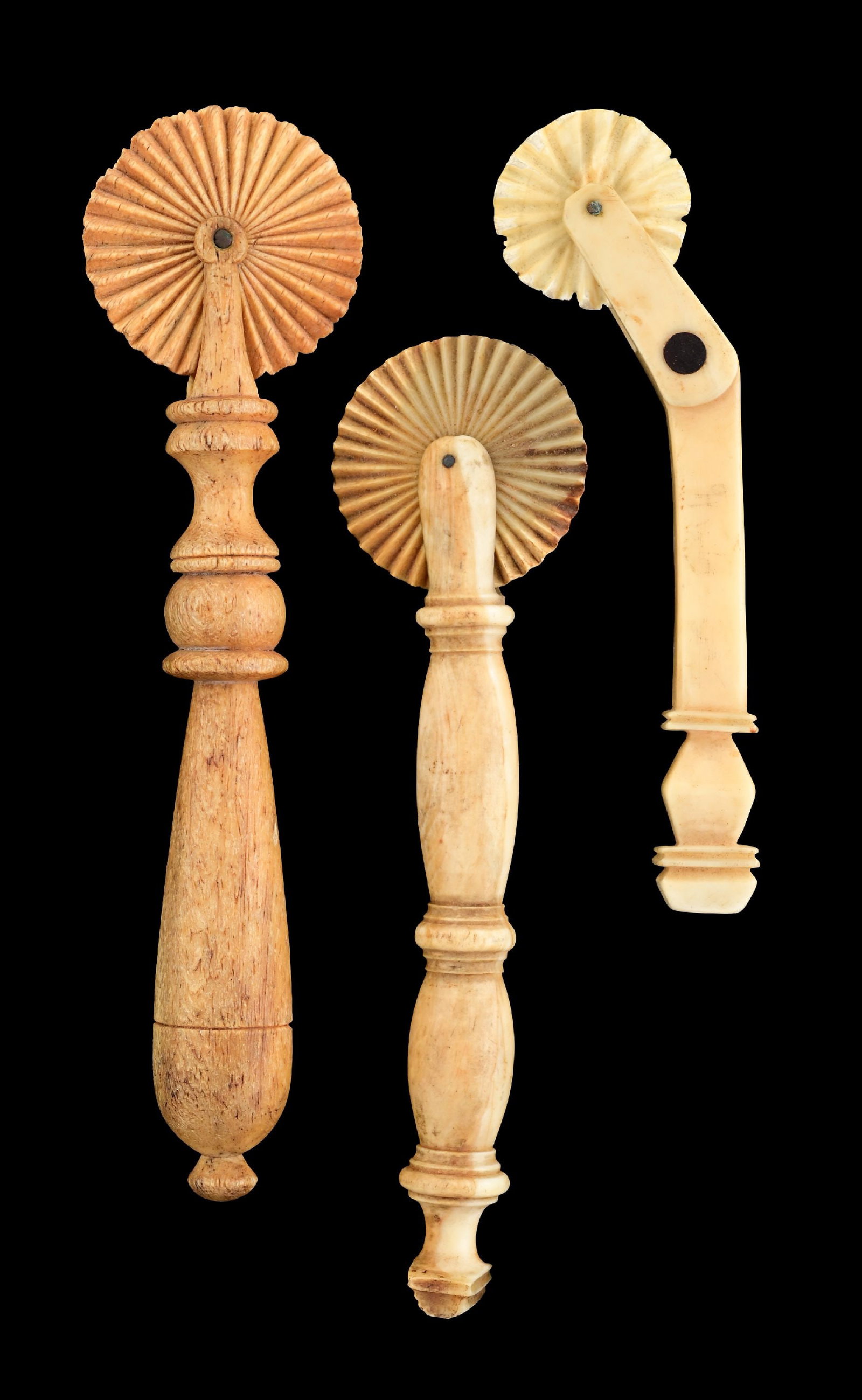 LOT OF 3: 19TH CENTURY WHALE IVORY JAGGING WHEELS W/ BOOK BY RAFAEL OSONA: This is a wonderful lot of three Whale ivory jagging wheels from the William Coffin collection. All three are made of whale ivory and bone. Wonderful condition and examples. C. 1860 - 1880s. Includes 