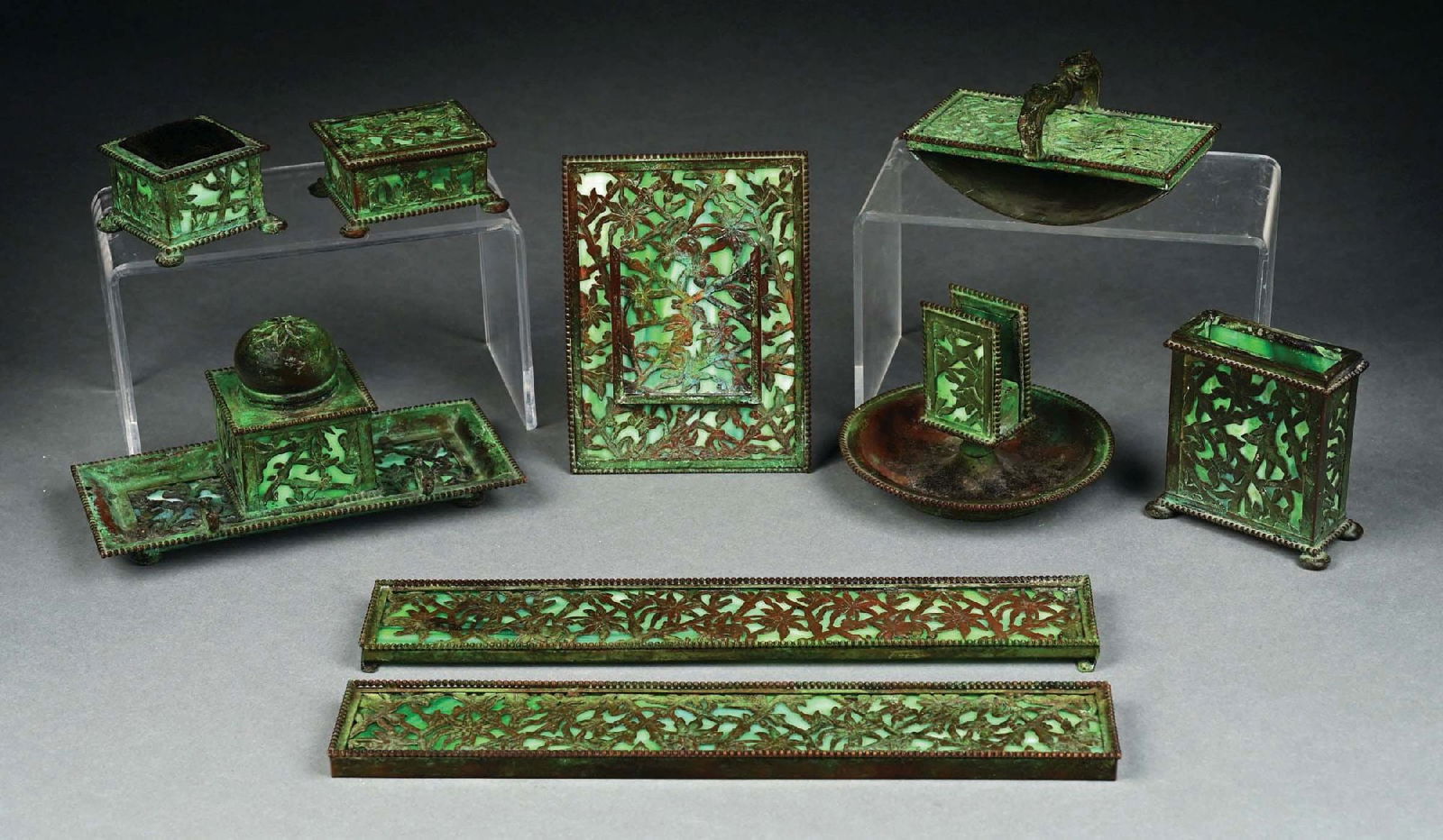 9-PIECE APOLLO STUDIOS DESK SET: A beautiful slag glass and patinated bronze desk set by Apollo Studios. The beautiful nine-piece set is composed of patinated bronze and green slag glass. The set includes rocker blotter with missing