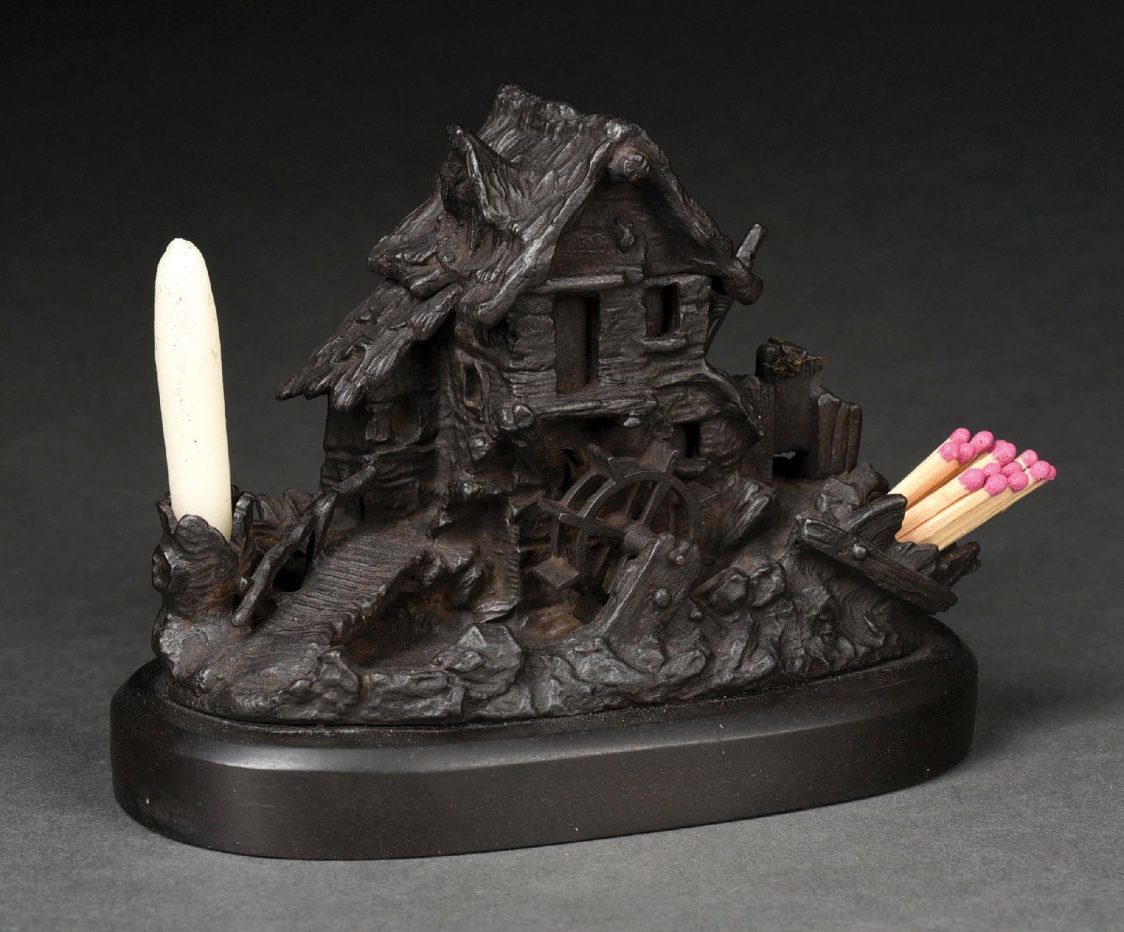 CAST IRON WATER MILL INKWELL & MATCH HOLDER: Lid on house opens to reveal inkwell. Holders for matches and candle. Water mill turns. No damage or repairs. Condition: (Excellent) Dimensions: 6 - 1/2" x 3 - 1/2" x 5".