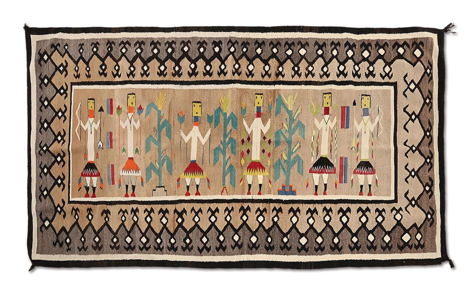 NAVAJO YEI DANCER TEXTILE: A nice vintage pictorial textile with six colorful figures holding bows, arrows, ribbons and corn separated with blue cornstalks. Tasseled corners and natural borders. 96" x 50" PROVENANCE: EX Ron and
