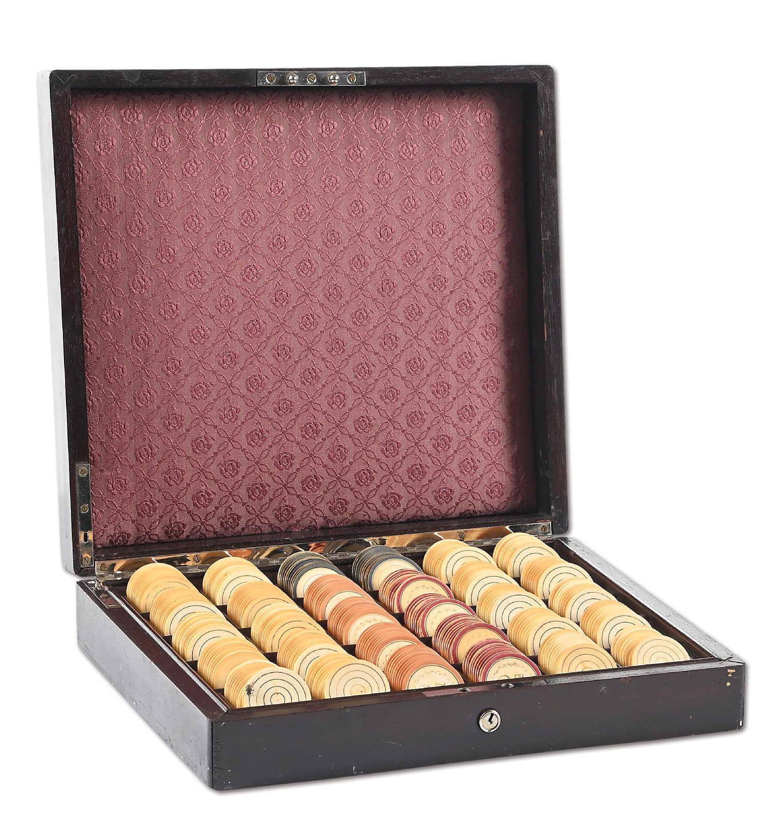 300 IVORY POKER CHIP SET IN MAHOGANY CASE: A set of 300 ivory poker chips consisting of 80 - $25 chips and 220 colored concentric circle chips. Housed in an original Mahogany case. CONDITION: Showing some wear to several chips, light fade to t