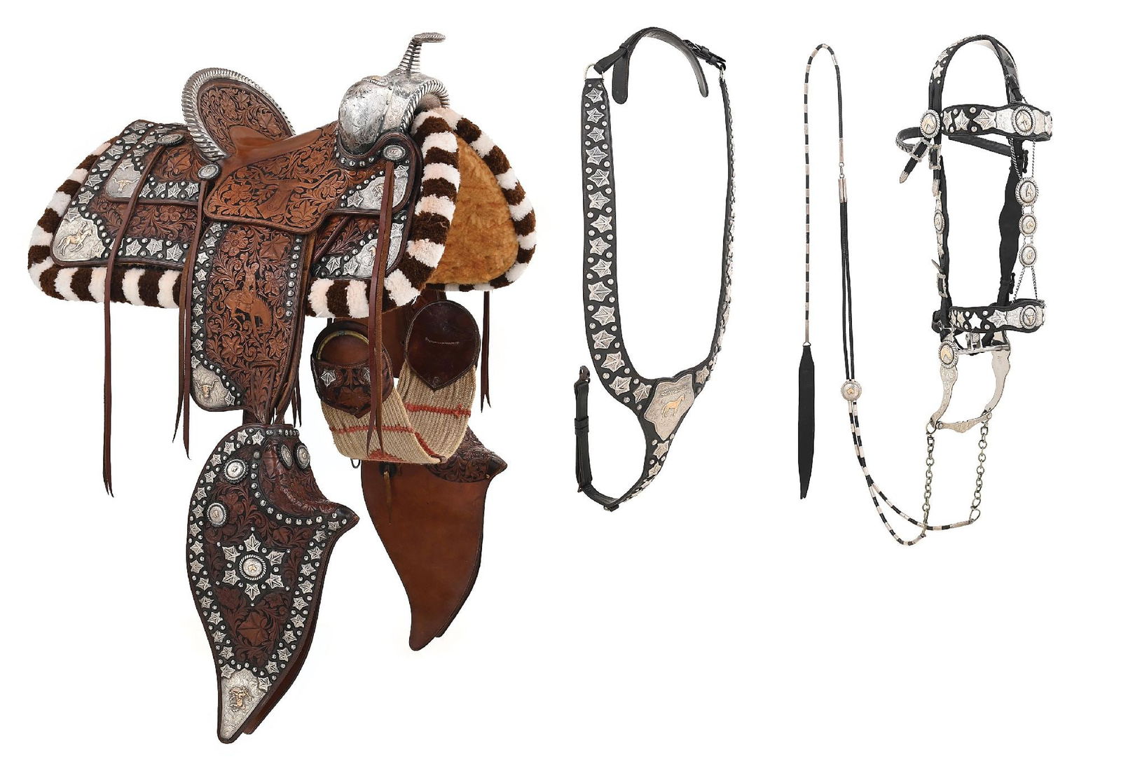 BREATHTAKING EDWARD H. BOHLIN "MACHRIS" PARADE SADDLE: Considered one of the standout pieces in the entire George Pitman collection, this exquisite two-tone brown floral carved Bohlin / Hollywood sterling and gold parade saddle, custom made for Louise Cot