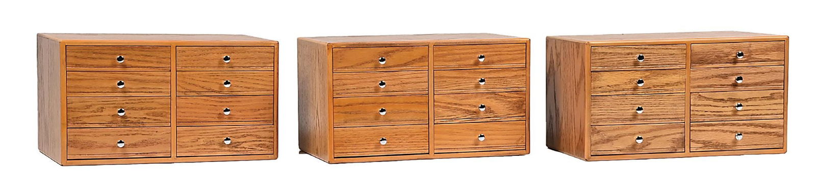 3 BOXES OF SADDLE PIECES, BUCKLES, FINDINGS, STERLING SILVER, ETC.: Three oak boxes with eight drawers each filled with sterling silver and German silver conchos, three-piece belt buckle sets for spurs, saddles, decorations, many marked "Edward Bohlin", "Sunset Trails