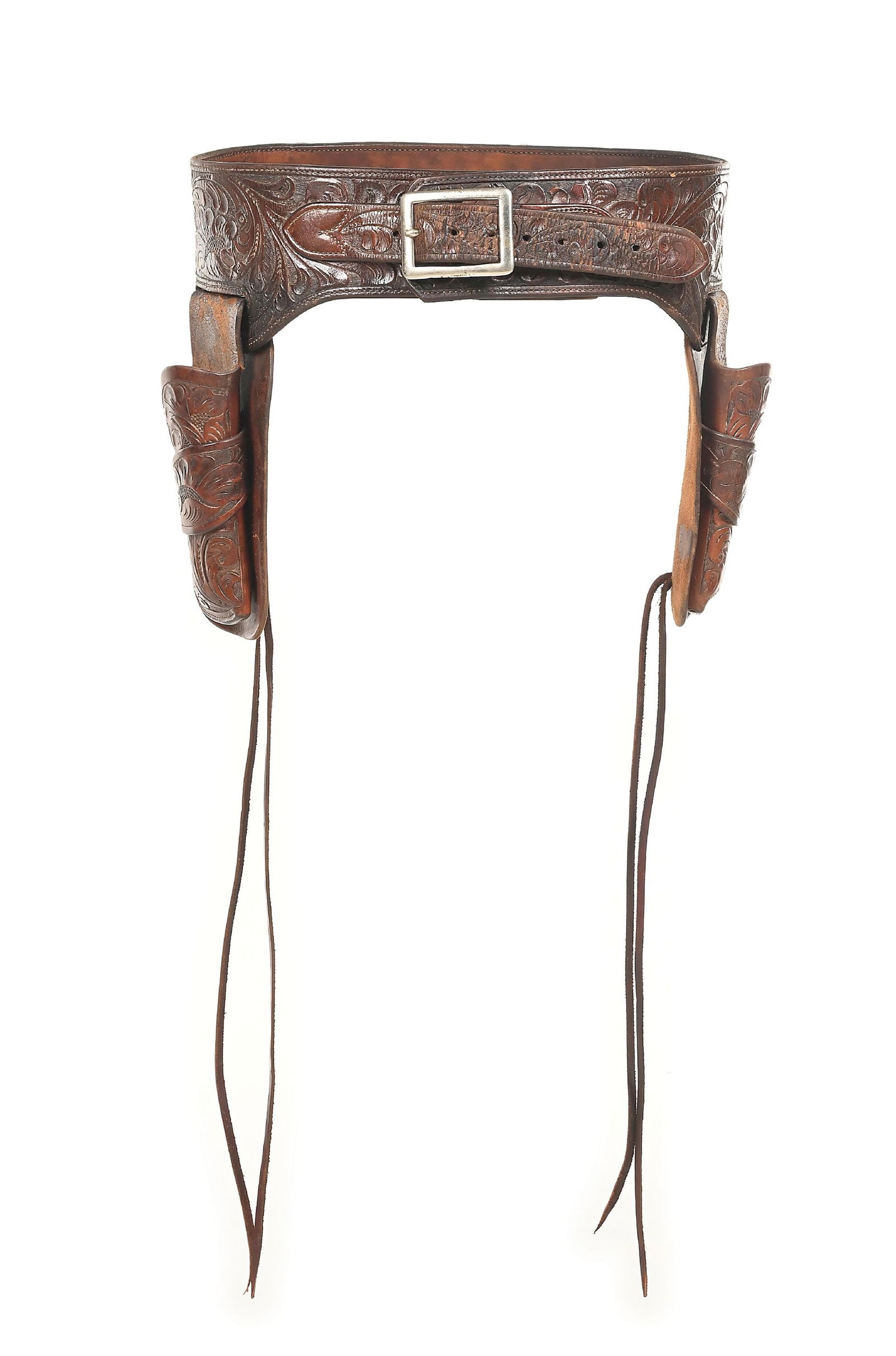 FRED MUELLER DOUBLE BUSCEDERO RIG: Floral tooled double holster gun rig with 2 single loop holsters for 4 3/4" Colt Single Action revolvers. Central 12 loop cartridge section, well marked on the billet. Shows use and has water on the i