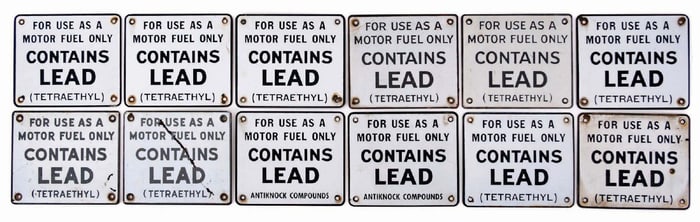 COLLECTION OF 12: CONTAINS LEAD GAS PUMP SIGNS
