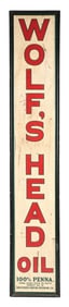 WOLF'S HEAD MOTOR OIL EMBOSSED TIN SIGN W/ ORIGINAL WOOD FRAME