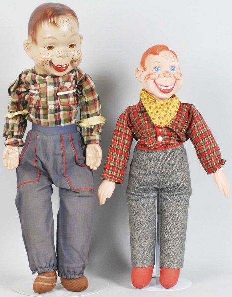 Lot of 2: Howdy Doody Dolls.: Includes one with composition head and one with plastic head. Some crazing to composition head and fading to original pants. Condition (Very Good). Size Largest: 22 - 1/2" T.