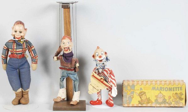 Lot of 3: Howdy Doody Doll & Marionettes.: Includes one movable mouth doll and two marionettes. One marionette depicts Howdy Doody and comes with original stand and the other depicts Clarabell the Clown and comes with original box. Box has cre