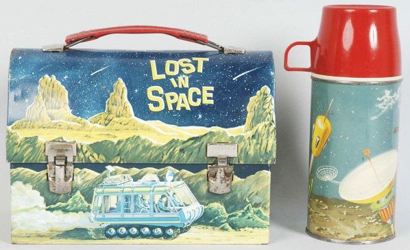 Scarce Tin Litho Lost in Space Lunch Box.: Dome-type. Includes space-themed thermos. Box has some scratching and edge wear along with some oxidation to bare metal parts. Condition (Very Good). Size 9" x 6- 1/2".