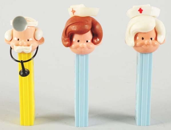Lot of 3: Pez Dispensers.: Includes one doctor and two nurses. One nurse with brown hair and one with blonde hair. Condition (Excellent). Size Largest: 4 - 1/2" T.