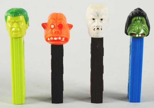 Lot of 4: Monster Pez Dispensers.: Includes a Hulk, a one-eyed monster, a werewolf and a Mr. Ugly. Condition (Excellent). Size Largest: 4" T.