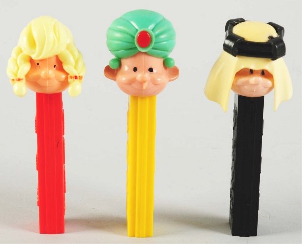 Lot of 3: Character Pez Dispensers.: Includes one blonde girl, one Arab, and one Sheik. Condition (Excellent). Size Largest: 4 - 1/2" T.