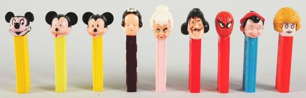 Lot of 9: Pez Dispensers.: Includes Snow White, painted Mickey, Tinker Bell, and others. Condition (Excellent Plus). Size Largest: 4 - 1/2" T.
