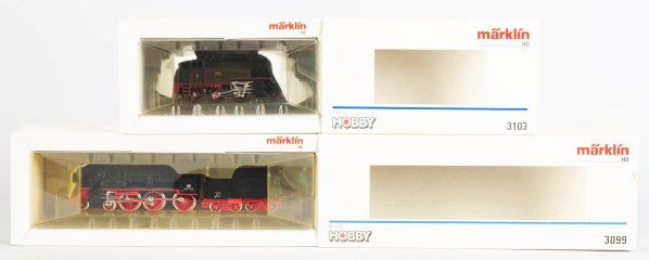 Lot of 2: Marklin HO Train Engines.: Contemporary. Includes one engine with tender and box marked "3099". Also includes engine with box marked "3103". Both in original boxes with some creasing. Condition (Excellent).