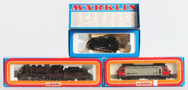 Lot of 3: Marklin HO Train Engines.: Includes one steam engine and tender in box "3111", one SBB CFF FFS engine in box "3323", and single engine in box "3096". All original boxes marked "Made in Western Germany". The single engine appear