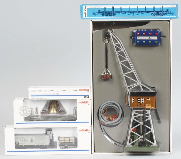 Lot of 4: Marklin HO Train Accessories.: Contemporary. Includes no. 7051 crane, 1996 Museum Car, and two flat cars. Includes all original boxes. Condition (Near Mint).