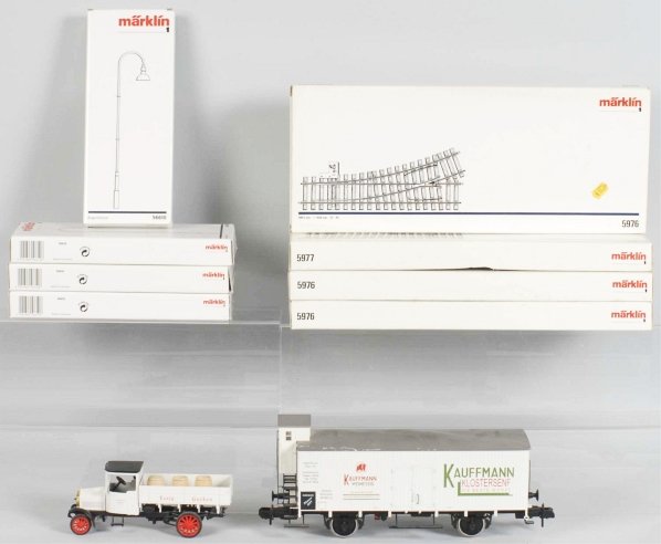 Lot of Marklin HO Train Accessories.: Includes lamp poles, track, and switches. Also includes a 1997 Museum train car set in box marked "58311". All with their original boxes. Condition (Near Mint).