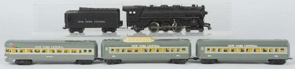 Marx New York Central Passenger Train Set.: Pre-war. Tinplate. Includes steam engine with matching New York Central tender and three meteor passenger cars. One of the passenger cars is a Vista Dome car. Some minor scratching and wear. Condition