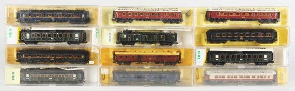 Lot of 12: German Trix HO Passenger Train Cars.: Various colors include brown, blue, and green; some are matching. Includes original plastic boxes. Condition (Near Mint) Size .