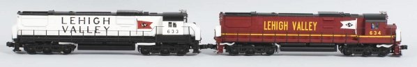 Lot of 2: Weaver Lehigh Valley Train Engines.: Contemporary. Three-rail. Includes no. 633 and no. 634 Alco engines. Includes both original boxes with some creasing and wear. Condition (Near Mint).
