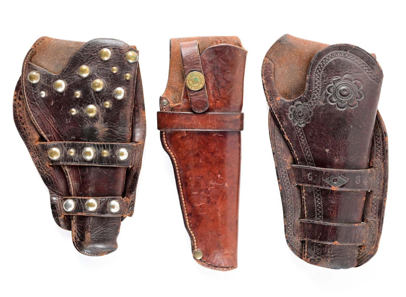 LOT OF 3: STUDDED, CARVED AND H. H. HEISER LEATHER HOLSTERS: Lot consists of: A)Double loop western holster with nickel spots. B) Heiser of Denver small frame revolver holster with safety strap. Maker stamped to the reverse: H.H. HEISER / MAKER / DENVER, COLO. 