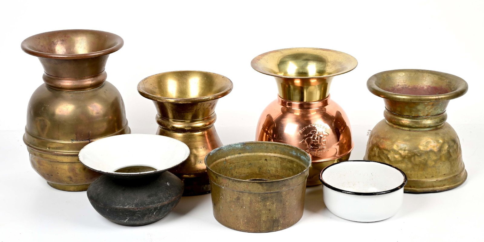 LOT OF 7 VINTAGE SPITTOONS: Mix of antique and reproduction brass and porcelain examples. Some weighted on the bottom. Largest 8" in diameter and 12 1/2" tall. CONDITION: Good. Dimensions: