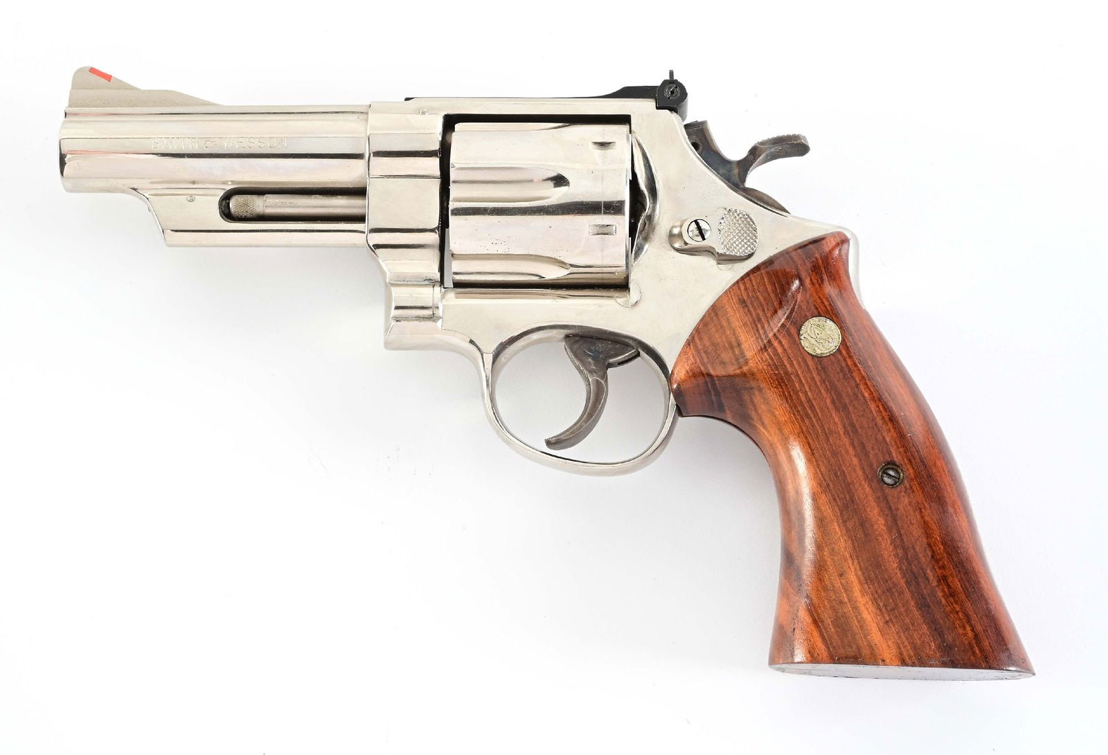 (M) NICKEL SMITH & WESSON MODEL 29-2 .44 MAGNUM DOUBLE ACTION REVOLVER.: Manufactured in 1973, the last of the pinned and recessed models. Features nickel finish, case color hammer and trigger, red insert front sight, adjustable rear sight, smooth silver medallion grips. B