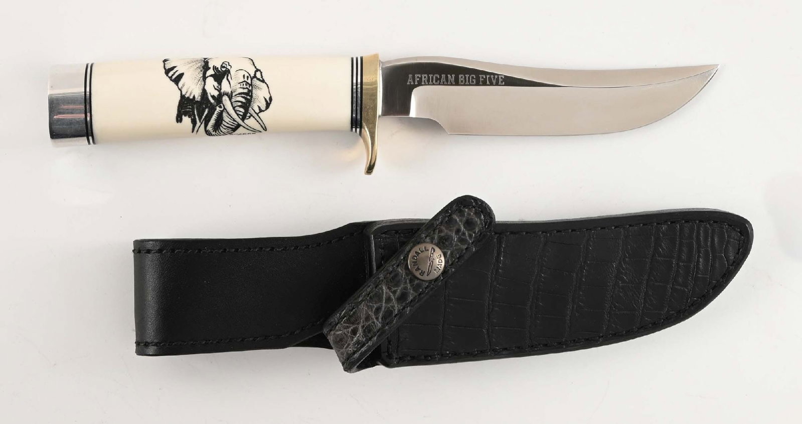 RANDALL AFRICAN BIG 5 ELEPHANT KNIFE.: Randall Made limited edition of 100 African Big Five Elephant scrimshaw model 3-5 Hunter fixed blade knife. Blade is marked "RANDALL MADE / ORLANDO, FLA S" between Randall's signature scimitars. Ivory