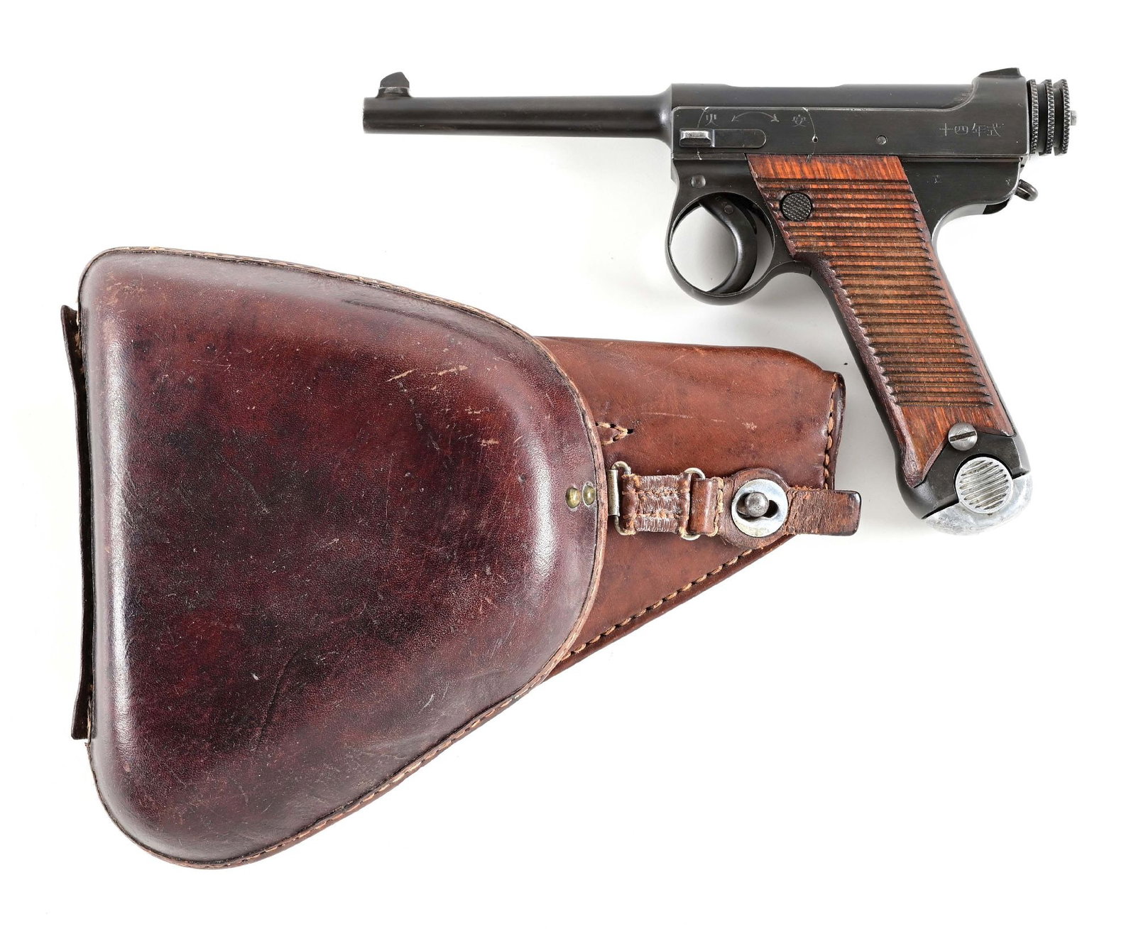 (C) TOKYO ARSENAL JAPANESE TYPE 14 8MM SEMI-AUTOMATIC PISTOL WITH HOLSTER.: Standard military issue made in 1929. Japanese legends found on both sides of slide, matte blue finish, serrated walnut grips, alloy base magazine, dovetailed front sight on base, fixed rear, and acco