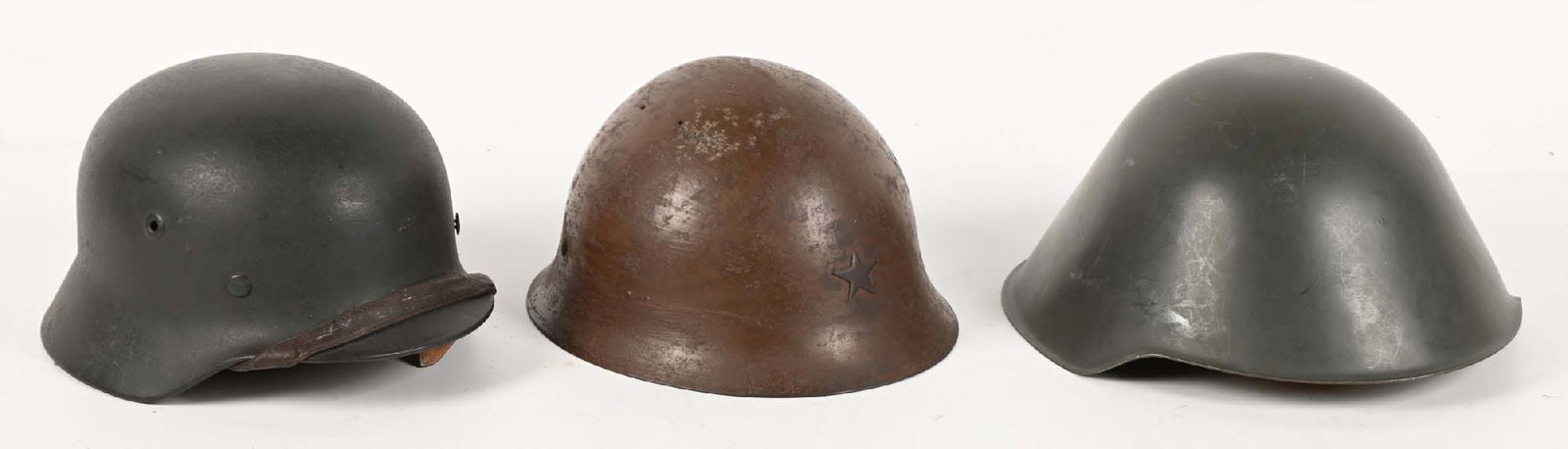 LOT OF 3: GERMAN WWII LUFTWAFFE M40 HELMET, JAPANESE TYPE 90 HELMET, AND EAST GERMAN M56/76 HELMETS.: Lot consists of: (A) German World War II M40 no decal helmet in a shell size marked "66" and lot number of "DV505". Shell retains almost all of its rough blue-gray paint, with light scrapes and scratc