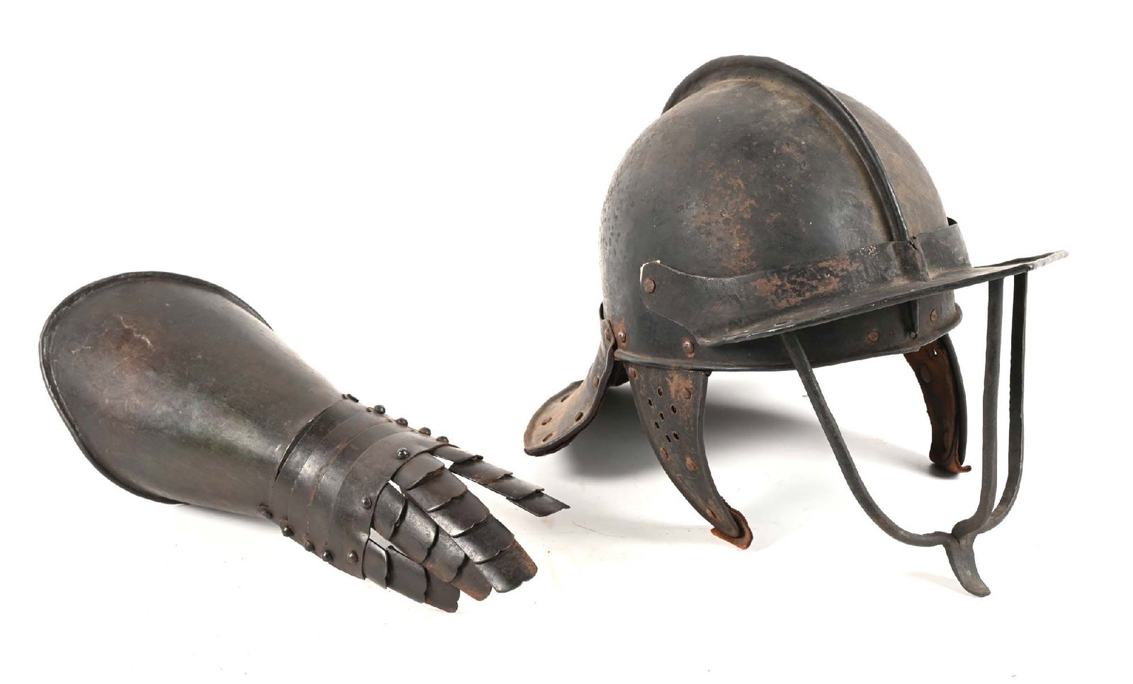 LOT OF 2: LOBSTER TAIL HELMET WITH GAUNTLET.: Victorian or later era reproductions of an English Civil War lobster tail helmet; gauntlet appears entirely modern. CONDITION: Fair, with areas of rust throughout.
