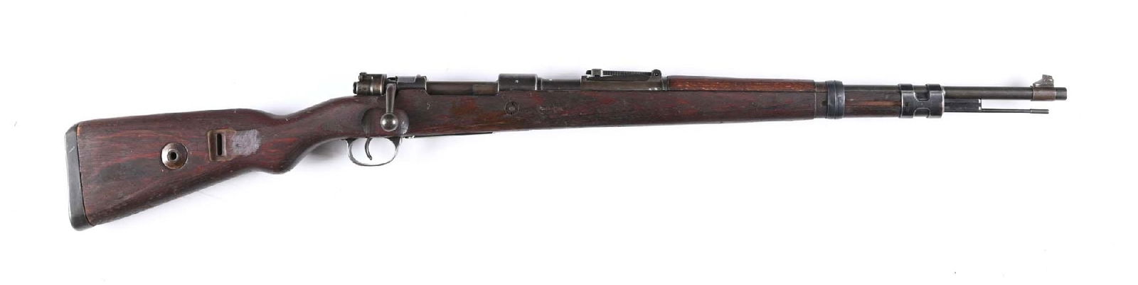 (C) SCARCE J.P. SAUER SCRIPT CE 42 CODE K98 MAUSER BOLT ACTION RIFLE (1942).: Manufactured in 1942. Standard military form as assembled with mixed numbers. Features include blade front sight, tangent rear, red glue laminate stock, milled mounts, and a cupped butt plate. No band