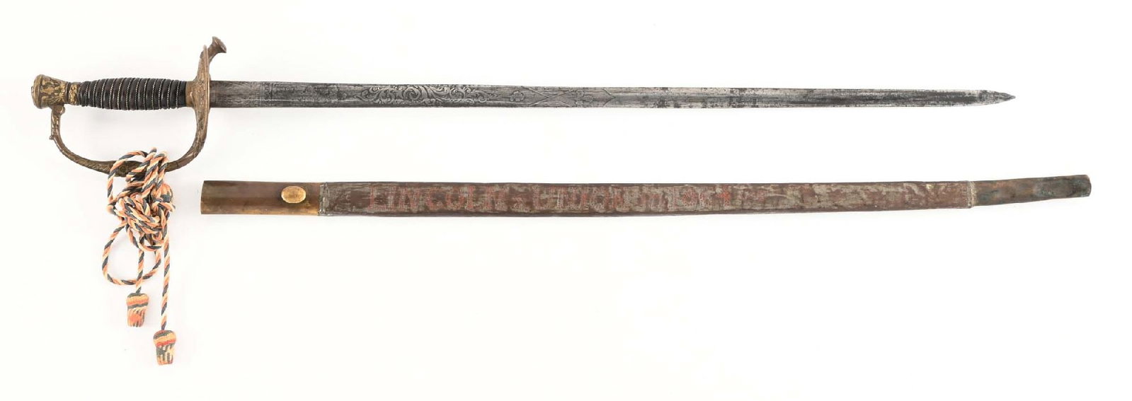 US M1872 STAFF OFFICER SWORD WITH DECORATED SCABBARD.: M1972 staff officer's sword in standard configuration with a blade etched with foliate motifs for half its length. The sword is housed in a mismatched scabbard that is decorated with stippled Civil Wa