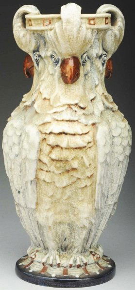 Amphora Cockatoo Vase.: 12" T. Vase depicting three cockatoos. Amphora oval mark. Illustrated in Antique Trader Pottery & Porcelain Ceramics Price Guide, 4th ed., p. 55. (Mint).
