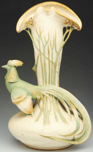 Amphora Ceramic Pheasant Vase.: 16 - 1/2" T. Vase with applied pheasant standing at base. In green and beige with gold highlights. Amphora oval mark on the underside. Similar to "House of Amphora" p. 116. (Mint).