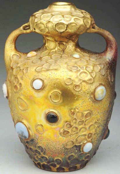 Two-Handled Amphora Ceramic Gres-Bijou Vase.: 8" T. Highly iridescent gold glazes to a matte burgundy. Applied jewels. Marked on underside. (Mint).