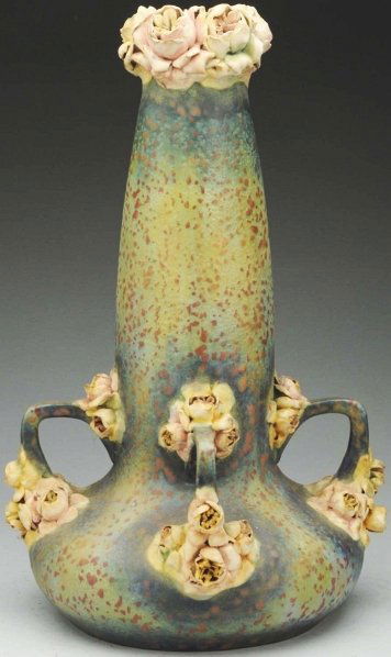 Amphora Vase with Applied Roses.: 18" T. Four handles at bottom. Amphora oval and crown marks. Drilled as a lamp. (Very Good).