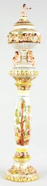 Capo Di Monte Italian Lidded Urn & Stand.: Urn and stand are embossed with children playing instruments. No chips, cracks or repairs. Condition (Excellent). Size Largest: 31 - 1/2" T.