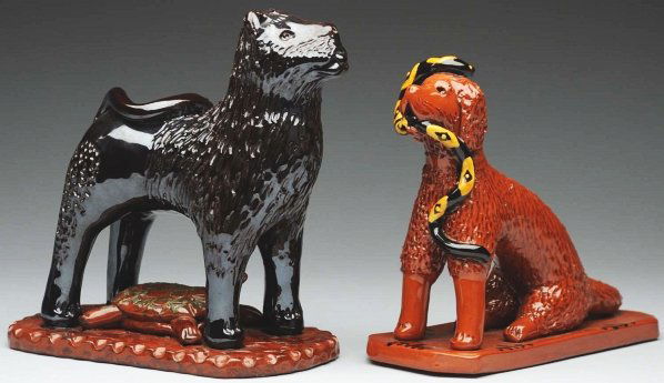 Pair of Large Lester Breininger Figurals.: Largest: 7 - 1/2" T. Includes one redware dog with a snake in its mouth and one lion attached to an incised base with a sprawling turtle underneath. Both appear to be in original condition. (Excellent