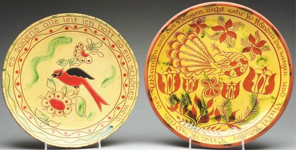 Pair of Lester Breininger Redware Chargers.: Largest: 13 - 3/4" Dia. Includes one highly decorated charger with German writing and original peafowl and floral decoration. Also includes one charger decorated with a cardinal on a branch. Both piec