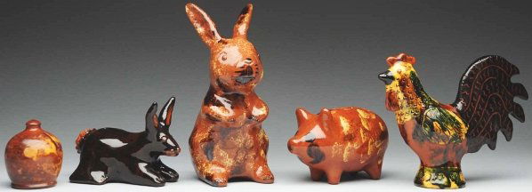 Lot of 5: Lester Breininger Banks.: Largest: 8 - 1/2" T. Includes two rabbits, one pig, one rooster, and one small redware slip-decorated bank with numerous cracks and repairs. (Excellent).