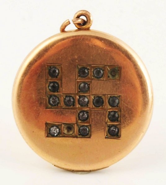 Gold Filled Locket with Swastika Design.: Missing two gems. Condition (Very Good). Size 1 - 1/4" Dia.