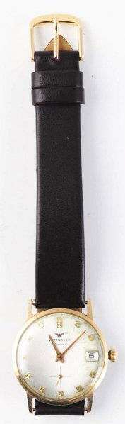 Wittnauer Geneve Wrist Watch.: Circa 1970. 17 jewels. 10K gold-filled. Date window. Date 12/25/70. Inscribed "Robin with Love Sharon". Condition: 7.