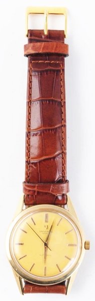 Universal Geneve Wrist Watch.: Circa 1960s. 17 jewels. 14K gold. Serviced and cleaned. Case # 14717. Swiss.