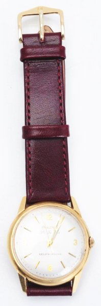 Bulova #6 Self-Winding Wrist Watch.: 1960s. 30 jewels. Gold numerals. 14K gold case with leather band. Waterproof and shock resistant. Condition: 8.