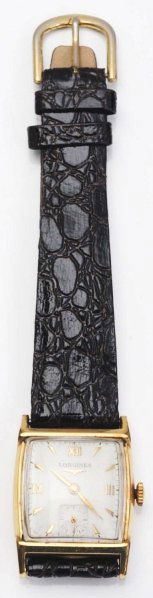 Longines Wrist Watch.: Circa 1950. 17 jewels. 10K gold-filled. Inscribed "From Chris 12-25-1950". Black band.