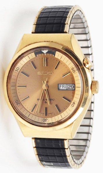 Seiko Wrist Watch.: Circa 1960s. Japan. Automatic day-date. Expansion band. Revolving dial (pull-out crown). Date change: push top button. Condition: 7.
