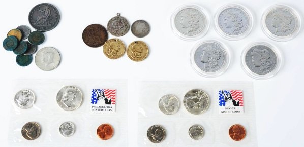 Lot of US Coins.: Includes five Morgan silver dollars, 1878-S trade dollars, four Indian cents, three zinc pennies, 1964 Kennedy half dollars, five foreign coins, 1959 Denver, and 1959 Philadelphia mint sets. Condition